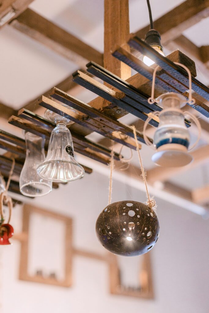 Unique vintage-style lights and glass pieces creatively displayed indoors.