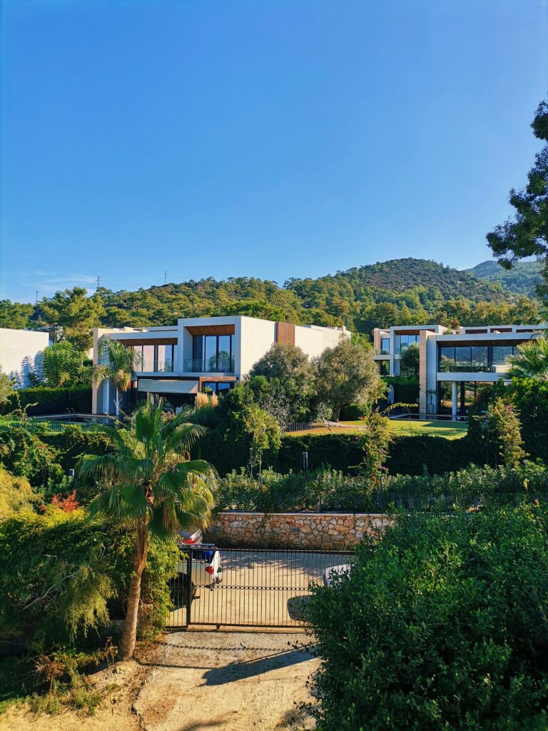 Beautiful modern villas surrounded by lush greenery in Muğla, Turkey.